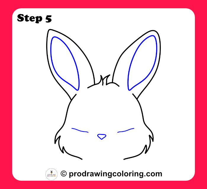 Adding inner ear details and a small triangular nose to the face.