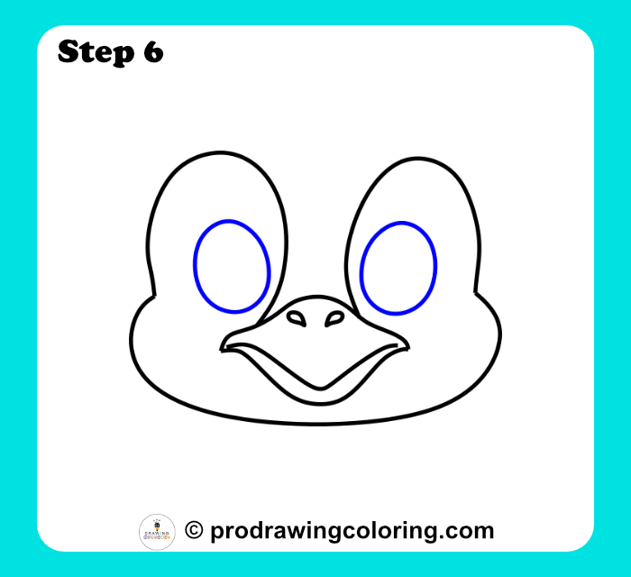 Penguin eyes drawn as two vertical ovals showing how to draw the face simply.